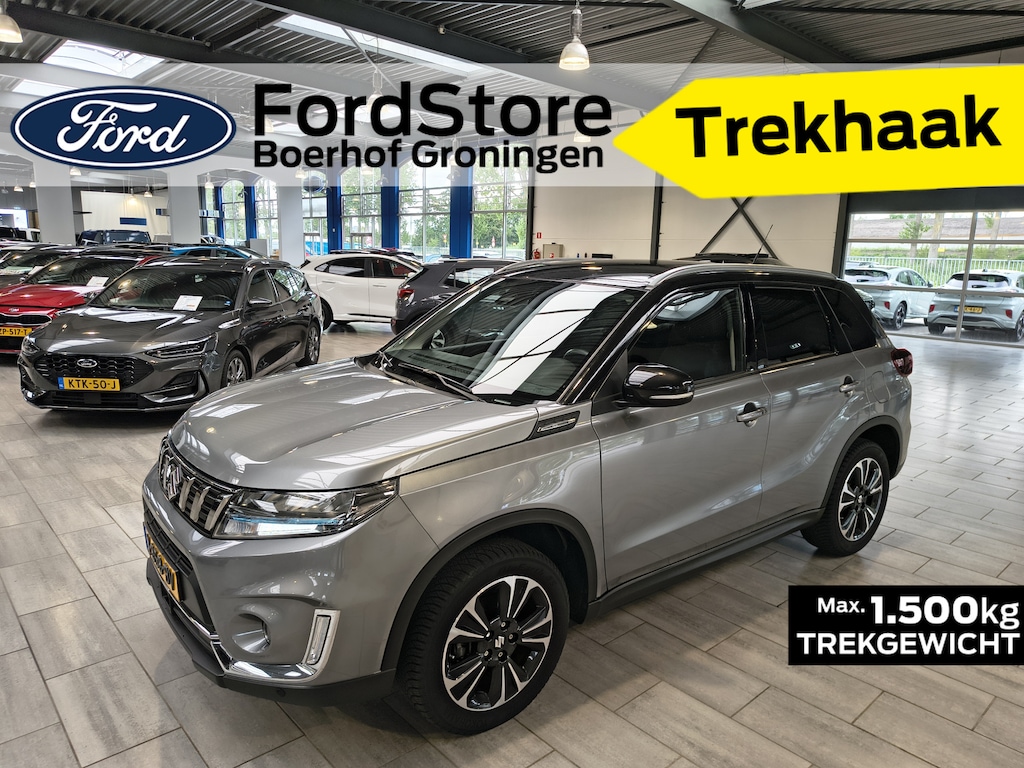 Suzuki Vitara 1.4 Boosterjet Style Smart Hybrid | Trekhaak | Half leer | Adapt. cruise | 4 seiz. banden | 1e eig. | 100% dealer onderh.