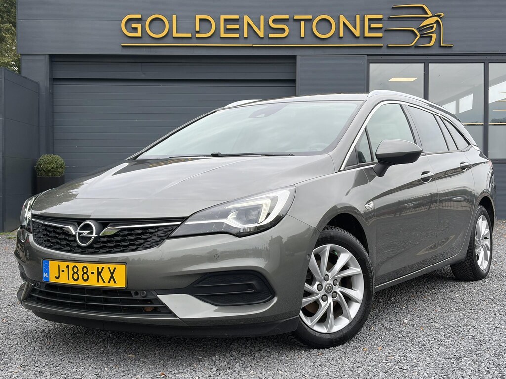 Opel Astra Sports Tourer 1.2 Elegance ✓131pk✓2e Eigenaar✓Camera✓Carplay✓6 Bak✓Stoelverw✓Stuurverw✓Pdc V+A✓Recent beurt gehad✓Clima✓Cruise✓Halfleder✓Keyless✓N.A.P✓Lm velgen✓Rijstrooksensor✓Apk tot 09-2028