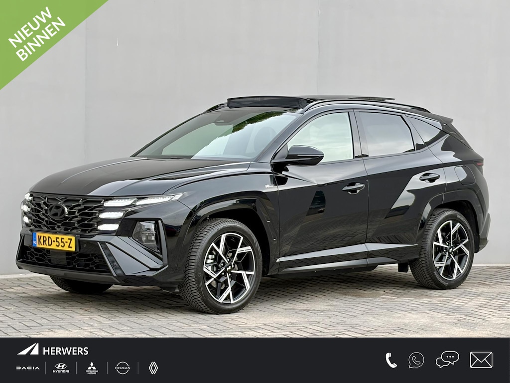 Hyundai Tucson 1.6 T-GDI PHEV N Line Sky 4WD / Facelift / Fabrieksgarantie tot 12-2029 / Dealer onderhouden / Panorama schuifdak / Navigatie / Camera / Elektrische Achterklep / Stuur & Stoelverwarming / Apple Carplay Android / 19" LM wielen /