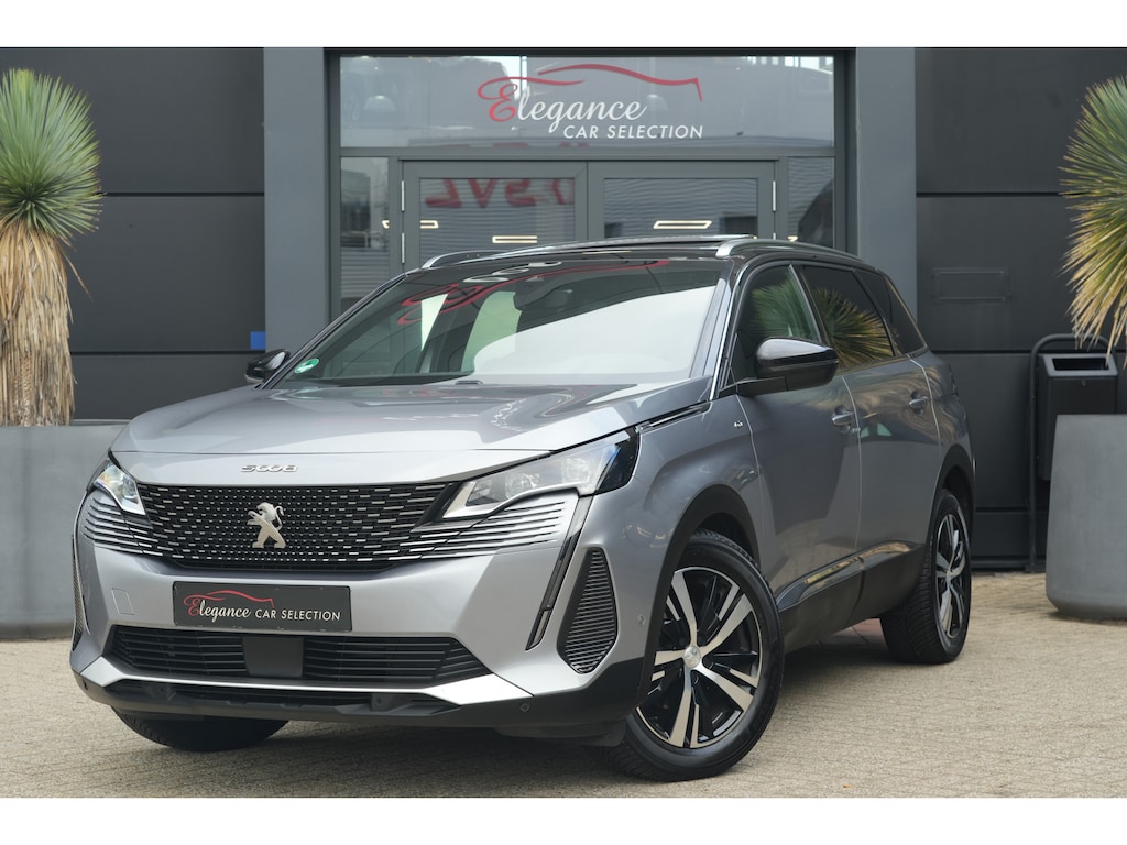 Peugeot 5008 1.2 PureTech GT | 131PK | 7-zits | Pano | Navigatie | Stoelverwarming | 360° camera Peugeot 5008 1.2 Puretech GT 131 PK met 1.2 viercilinder motor, panoramadak, 7-zits, stoelverwarming, 360° camera, navigatie, lichtmetalen velgen