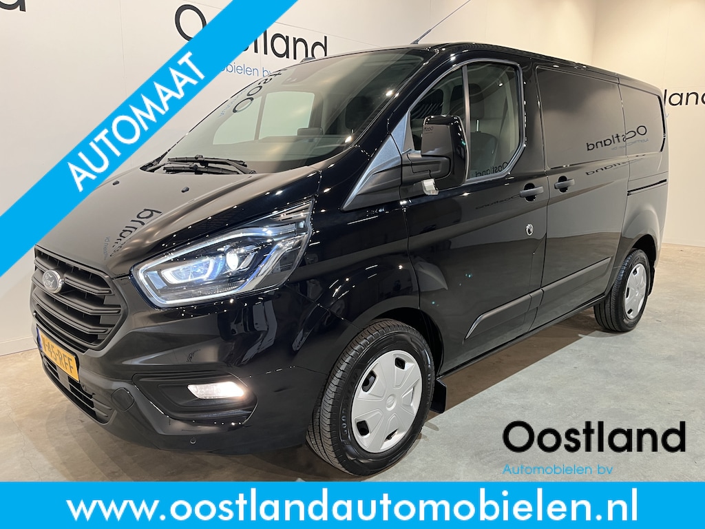 Ford Transit Custom 300 2.0 TDCI L1H1 Trend 130 PK Automaat / Euro 6 / Schuifdeur L + R / Airco / CarPlay / Cruise Control Adap. / Trekhaak / Xenon / Navigatie / 3-Zits / 27.300 KM !!