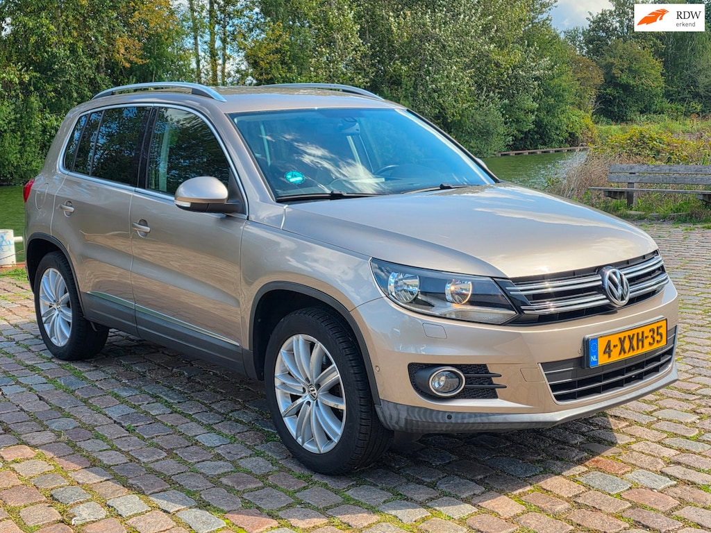 Volkswagen Tiguan 1.4 TSI Sport&Style R-line Edition 1e eigenaar dealer onderhouden navigatie parkeer sensor cruis control