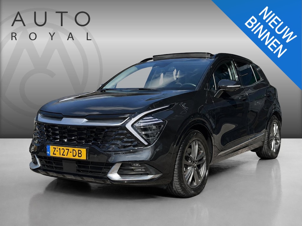 Kia Sportage 1.6 T-GDi Hybrid DynamicPlusLine TREK GEWICHT 1650 KG | LEDER | AWD | 360 GRADEN CAMERA | HARMAN/KARDON | ELEKTRISCH VERSTELBARE STOELEN | STOELVERWARMING | STUURVERWARMING | STOELKOELING | PANORAMADAK | NAVIGATIE | LED | DODEHOEK DETECTIE | APPLE CARPLAY / ANDROID AUTO | ADAPTIEVE CRUISECONTROL | FABRIEK GARANTIE 7 JAAR |