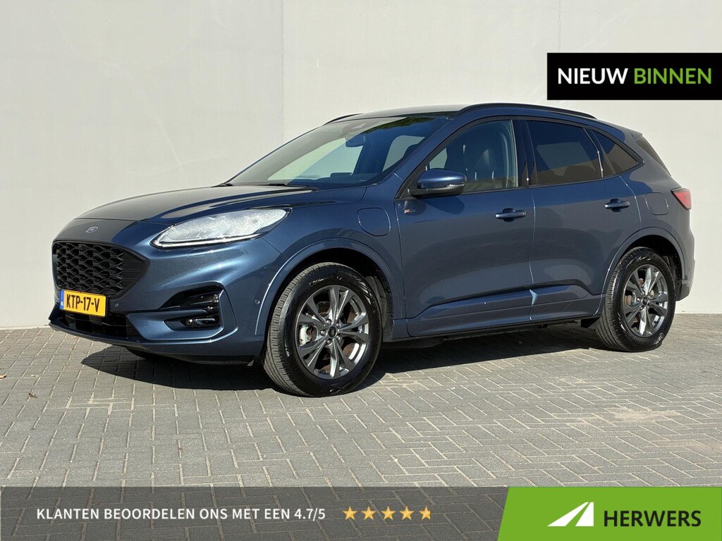 Ford Kuga 2.5 PHEV ST-Line X / Dealer onderhouden / Trekgewicht 1.500 kg / Navigatie / Stuur-, stoel- & achterbankverwarming / Parkeer assistent / Camera 360° / Elektrische stoel & klep / 18" LM wielen / Adaptief cruise control / Apple Carplay/Android Auto /