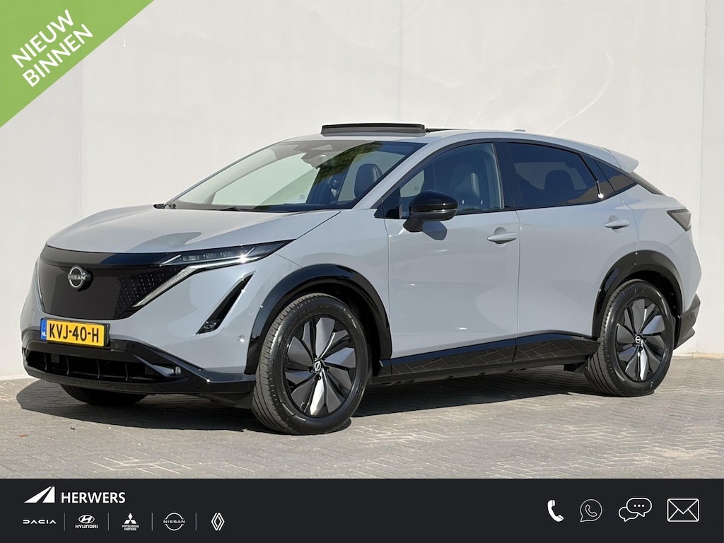 Nissan Ariya e-4ORCE Evolve 91 kWh 4WD / 306 PK / Leder / 1.500 kg Trekgewicht / Warmtepomp / 10 jaar Nissan More Garantie / Stoelverwarming voor en achter / Schuif-kantel dak / Stoelventilatie / Stuurverwarming / Rondomzicht camera / Elektrisch verstelbare stoelen met geheugen / Elektrische achterklep / Adaptieve cruise control / Apple Carplay/Android Auto /