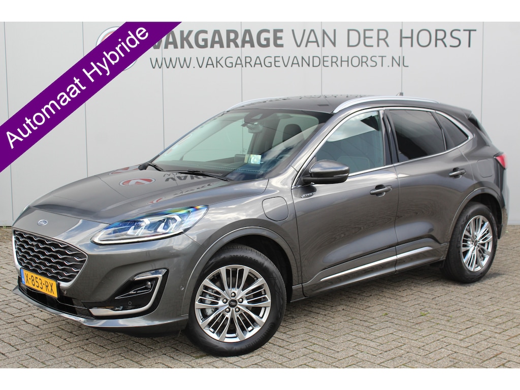 Ford Kuga 2.5-225pk PHEV Vignale. In uiterst nette staat verkerende Ford Kuga in de zeer chique Vignale uitvoering met slechts 23.000km ! Adapt. cruise cntrl, side- en lane assist, trekhaak, head-up display, B&O soundsyst., lederen int., stuur-, stoel-, achterbank- en voorraamverw. etc.