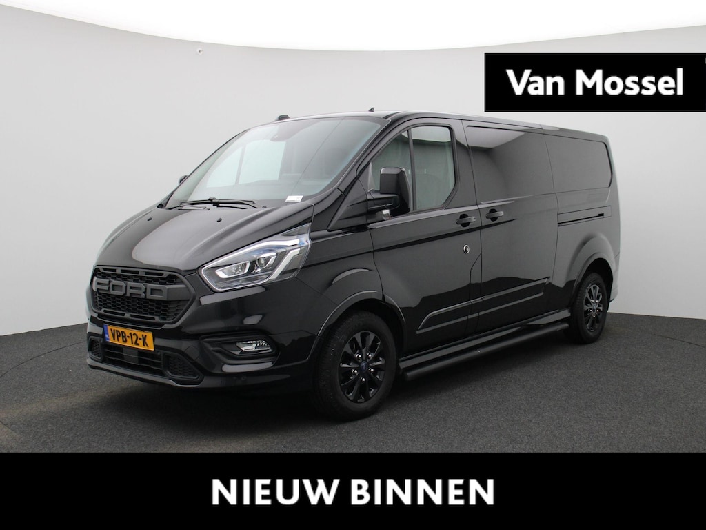 Ford Transit Custom 320 2.0 TDCI L2H1 Sport | 185 PK | AUTOMAAT | BI-XENON | CAMERA | NAVIGATIE | DODE-HOEK BEWAKING | TREKHAAK |  RAPTOR GRILLE | STOELVERWARMING | VOORRUITVERWARMING |