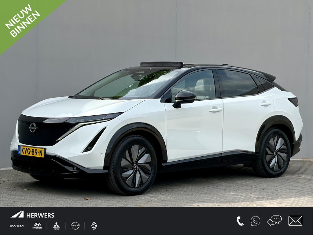 Nissan Ariya e-4ORCE Evolve 91 kWh 4WD / 306 PK / Leder / 1.500 kg Trekgewicht / Warmtepomp / 10 jaar Nissan More Garantie / Stoelverwarming voor en achter / Schuif-kantel dak / Stoelventilatie / Stuurverwarming / Rondomzicht camera / Elektrisch verstelbare stoelen met geheugen / Elektrische achterklep / Adaptieve cruise control / Apple Carplay/Android Auto /