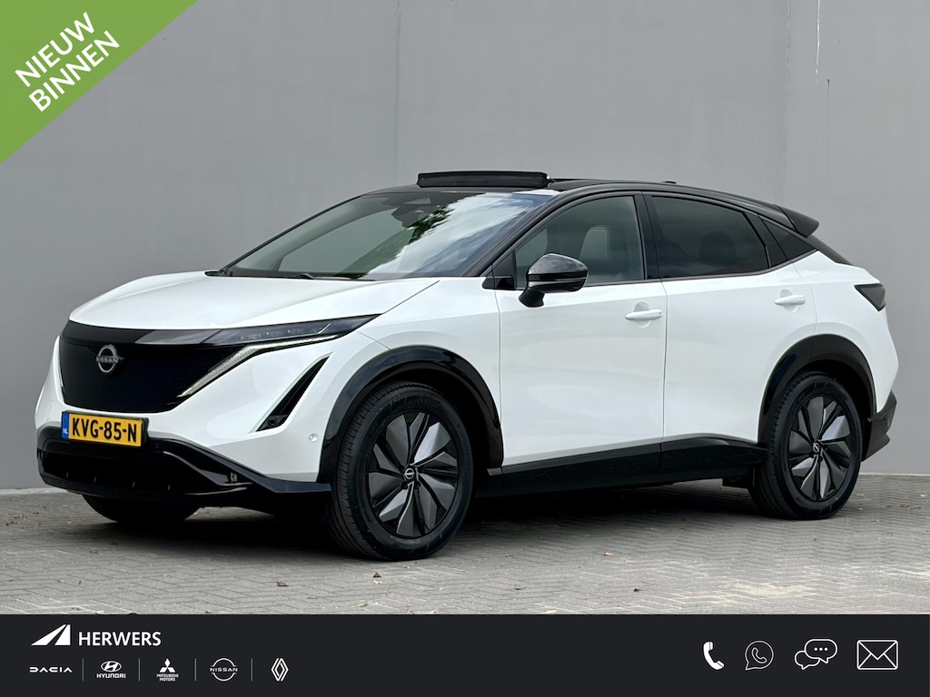 Nissan Ariya e-4ORCE Evolve 91 kWh 4WD / 306 PK / Leder / 1.500 kg Trekgewicht / Warmtepomp / 10 jaar Nissan More Garantie / Stoelverwarming voor en achter / Schuif-kantel dak / Stoelventilatie / Stuurverwarming / Rondomzicht camera / Elektrisch verstelbare stoelen met geheugen / Elektrische achterklep / Adaptieve cruise control / Apple Carplay/Android Auto /