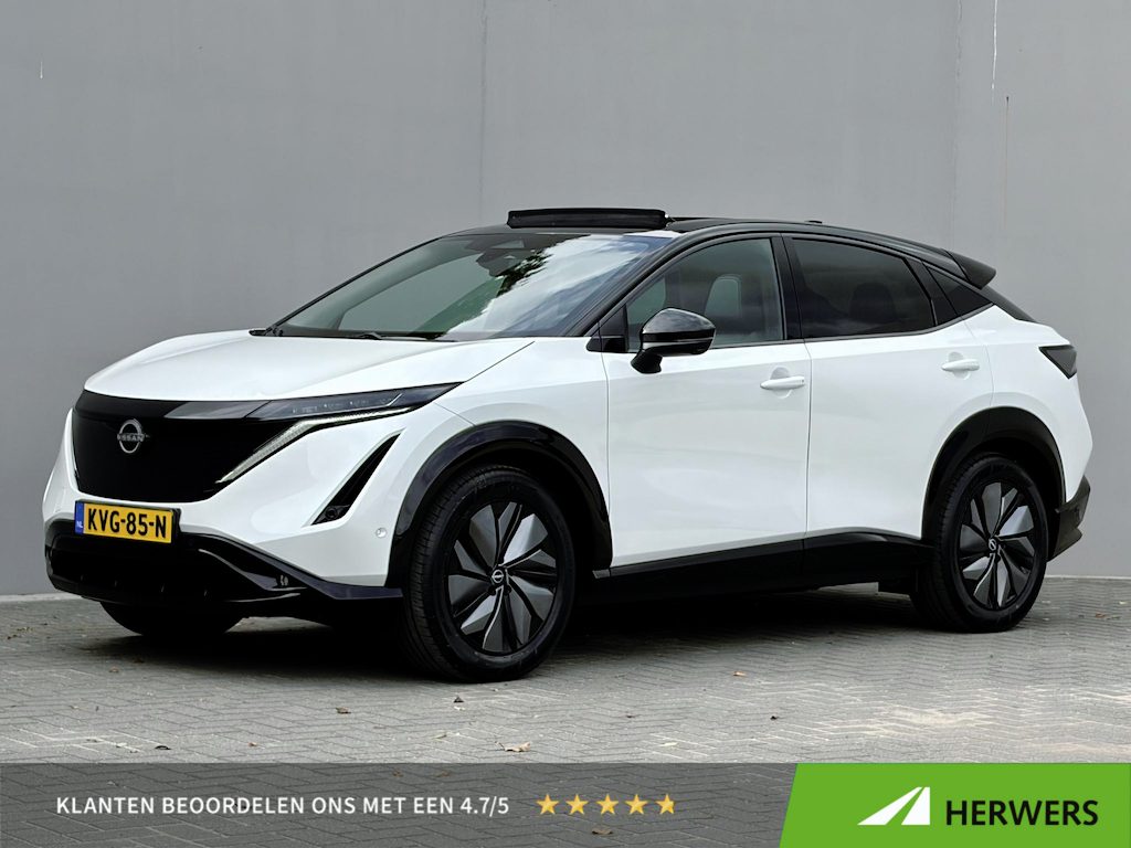Nissan Ariya e-4ORCE Evolve 91 kWh 4WD / 306 PK / Leder / 1.500 kg Trekgewicht / Warmtepomp / 10 jaar Nissan More Garantie / Stoelverwarming voor en achter / Schuif-kantel dak / Stoelventilatie / Stuurverwarming / Rondomzicht camera / Elektrisch verstelbare stoelen met geheugen / Elektrische achterklep / Adaptieve cruise control / Apple Carplay/Android Auto /