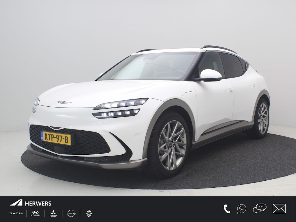 Genesis GV60 Long Range Dual Motor Premium 77,4 kWh AWD / SoH 100% / Fabrieksgarantie tot 11-2027 / WLTP 470 km / Panoramadak / Warmtepomp / B&O geluid / Acteruitrij Camera / Stoelventilatie / Elektrische achterklep / All Seasonbanden /