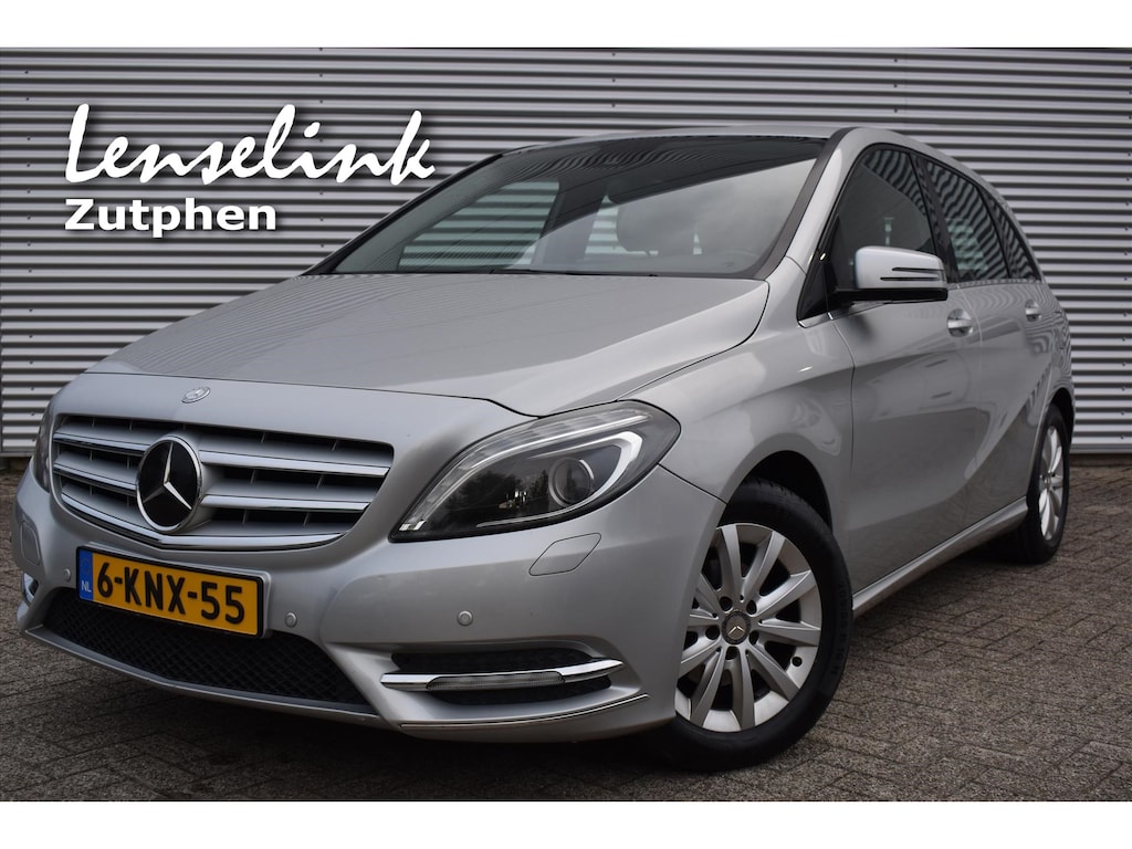 Mercedes-Benz B-klasse B180 AMBITION automaat | Trekhaak | Leder | Clima | PDC | Stoelverw. | Rijklaarprijs incl 12 mnd BOVAG garantie & onderhoudsbeurt !