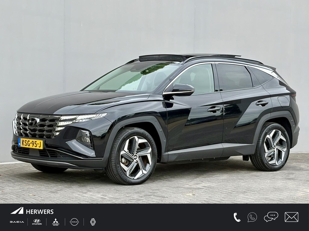 Hyundai Tucson 1.6 T-GDI PHEV Comfort Smart Sky 4WD / Dealer Onderhouden / SOH 100% / Panoramadak / Adaptief Cruise Control / Navigatie / Achteruitrijcamera / Apple Carplay & Android Auto / Stoel & Stuurverwarming / 19" LM Velgen / Elektrische Achterklep /