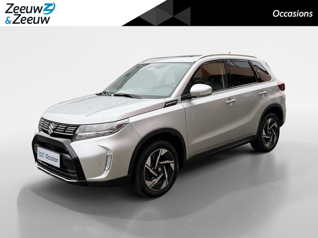 Suzuki Vitara 1.5 Hybrid Style 116PK AUTOMAAT Adaptieve Cruise | Parkeer sensoren| Metallic lak| 4 seizoen banden| Camera| Schuif en kanteldak| Navigatie| Stoel verwarming| Zeer netjes!