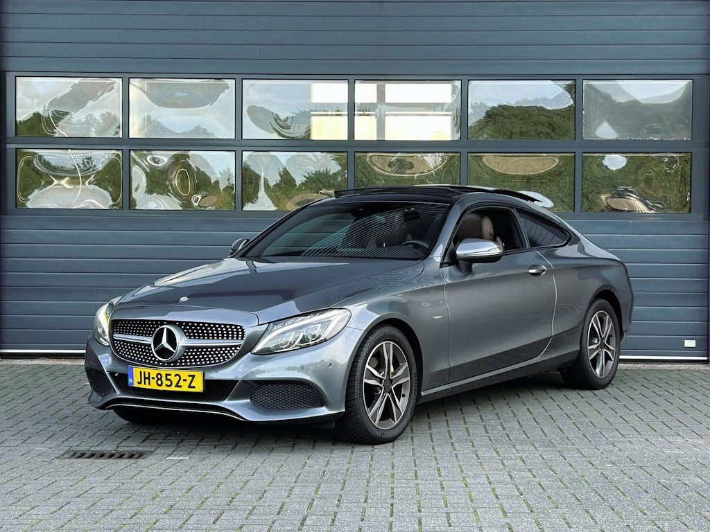 Mercedes-Benz C-klasse COUPÉ 180 EDITION ONE I AUTOMAAT I SCHUIF/KANTELDAK I LEDEREN BEKLEDING I STOELVERWARMING