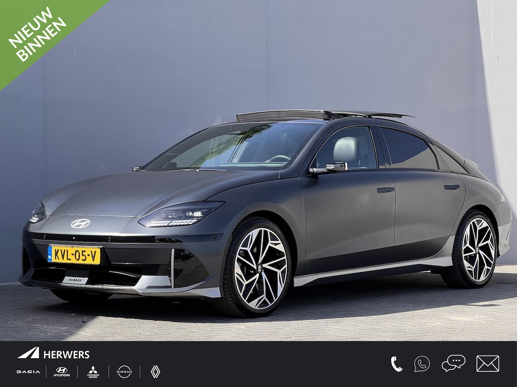 Hyundai Ioniq 6 Lounge 77.4 kWh / Dealer onderhouden / Fabrieksgarantie tot 05-2030 / Accu SoH 100% / Leder / Digitale buitenspiegels / Schuifdak / HUD / Elektrische stoelen & klep / Camera 360° / Stoelventilatie / Stuur-, stoel- & achterbankverwarming / 20" LM wielen & All Season Banden /