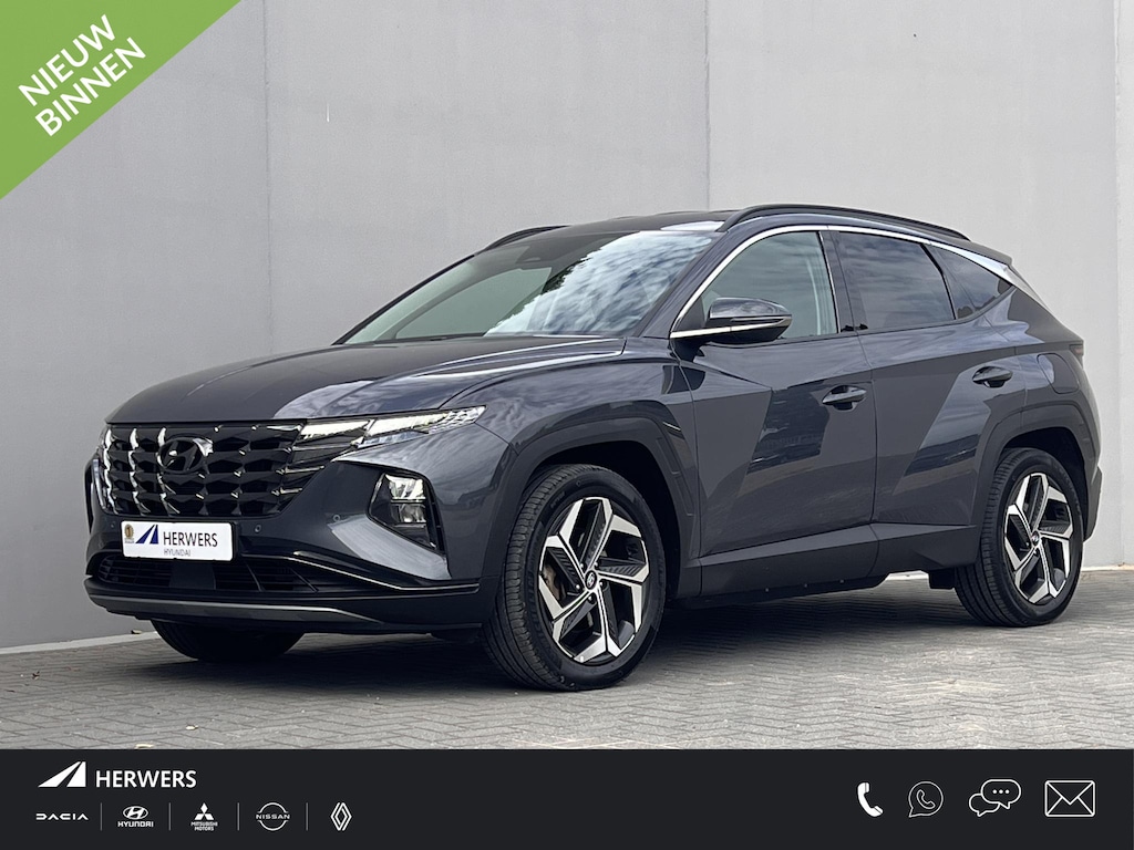 Hyundai Tucson 1.6 T-GDI PHEV Comfort Smart 4WD / 1.350 kg Afn. trekhaak / Dealer Onderhouden / Fabrieksgarantie tot 6-2029 / Accu SoH 89% / Elektrische klep / Stuur- en stoelverwarming / Navi / Apple Carplay Android / 19" LM wielen /