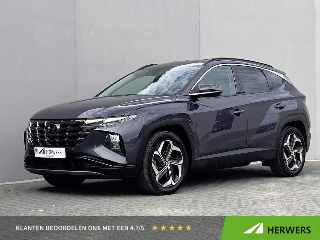 Hyundai Tucson 1.6 T-GDI PHEV Comfort Smart 4WD / 1.350 kg Afn. trekhaak / Dealer Onderhouden / Fabrieksgarantie tot 6-2029 / Accu SoH 89% / Elektrische klep / Stuur- en stoelverwarming / Navi / Apple Carplay Android / 19" LM wielen /