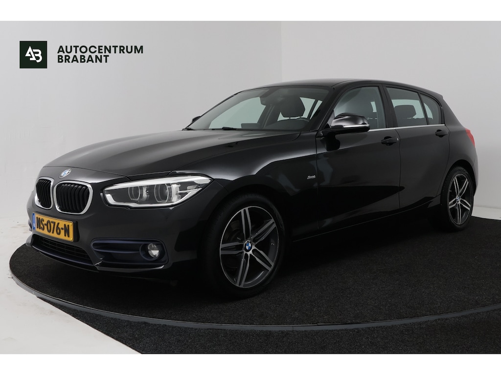 BMW 1-Serie 118i High Executive (CAMERA, STOELVERWARMING, NAVIGATIE, CRUISE CONTROL)