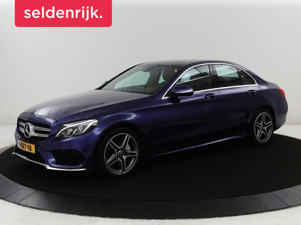 Mercedes-Benz C-klasse 200 Ambition AMG-line | Leder | Cruise control | Elektrische stoelen | Navigatie | Bluetooth | Park assist | Climate control | Full LED | 18" velgen