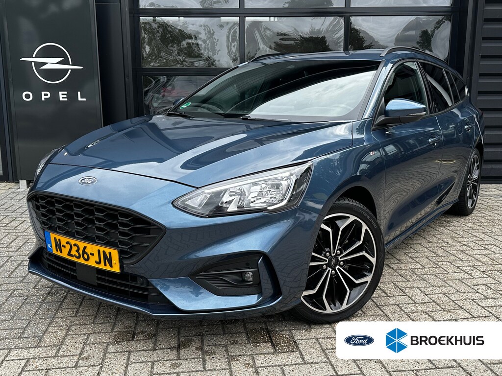 Ford Focus Wagon 1.0 125 PK ST Line | TREKHAAK| STOEL, STUUR EN VOORRUITVERWARMING| 18" LM-VELGEN| NAVIGATIE + APPLE CARPLAY/ANDROID AUTO| KEYLESS ENTRY & START| PARKEERSENSOREN ACHTER| DEALER ONDERHOUDEN|