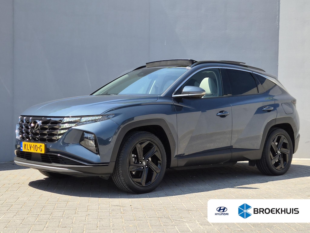 Hyundai Tucson 1.6 T-GDI PHEV Premium Sky 4WD / Glazen schuif- en kanteldak / Rondomzicht camera / Trekgewicht 1.350 kg / Elektrische achterklep / Stuur- Stoel & Achterbank verwarming / Adaptief cruise control / Stoelventilatie / Apple Carplay Android Auto /