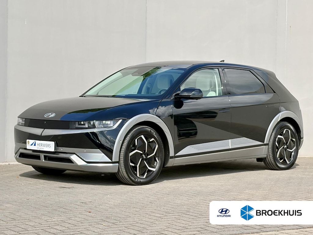 Hyundai Ioniq 5 Lounge 77.4 kWh / Relax Pakket / SOH 99% / Dealer Onderhouden / Fabrieksgarantie tot 11-04-2029 / CCS Snel Laden / Lederen Bekleding / Stoelventilatie / Elektr. Voorstoelen / Elektrische Achterklep / Stuur-, Stoel- & Achterbankverwarming / Achteruitrijamera / Navi / Apple Carplay & Android Auto / 19" LM wielen /