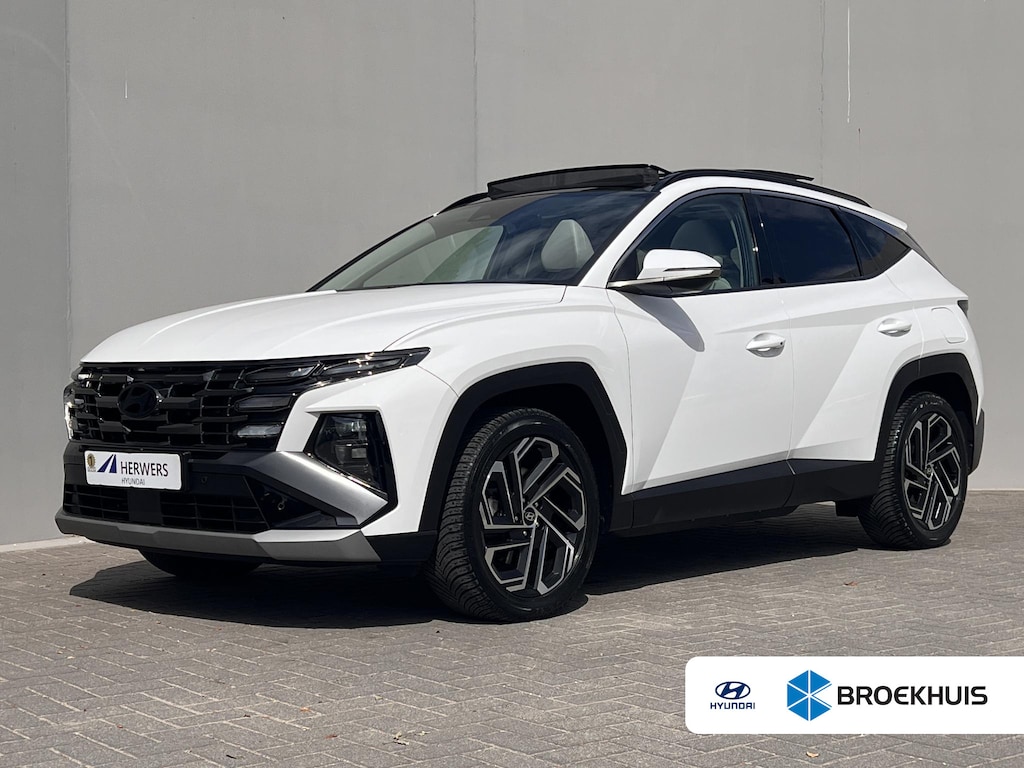 Hyundai Tucson 1.6 T-GDI PHEV Premium Sky 4WD / Accu SoH 100 % / Panorama schuifdak / Wit leder / HUD / Camera / Elektr. stoelen & klep / Stoelventilatie / Stuur-, stoel- en achterbankverwarming /19" LM wielen & All Season banden / | Accu State of Health 100 % | Apple Carplay/Android Auto | Atlas White Solid / Accu SoH 100 % / Panorama schuifdak / Wit leder / HUD / Camera / Elektr. stoelen & klep / Stoelventilatie / Stuur-, stoel- en achterbankverwarming /19" LM wielen & All Season banden /