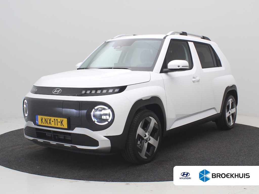 Hyundai Inster Evolve 49 kWh / Navigatie / Adaptieve Cruise Control / NL Auto / Fabrieksgarantie / Keyless Entry / 17" LMV / Dakrails / Historie aanwezig / | 17" LMV / Verschuifbare achterbank / 3-Fase Laden | Achteruitrijcamera | Apple Carplay/Android Auto|telefoonintegratie premium