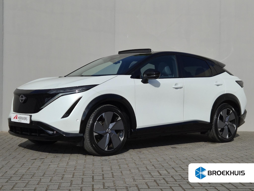 Nissan Ariya e-4ORCE Evolve 91 kWh / SOH 99% / Fabrieksgarantie tot 01-2027 / CCS snelladen / Trekgewicht 1500 kg / Warmtepomp / Bose Audio Systeem / Stoelventilatie / Elektrische achterklep / Head Up Display / Glazen schuif- en kanteldak / Stuur- Stoel & Achterbank verwarming / Rondomzicht camera /