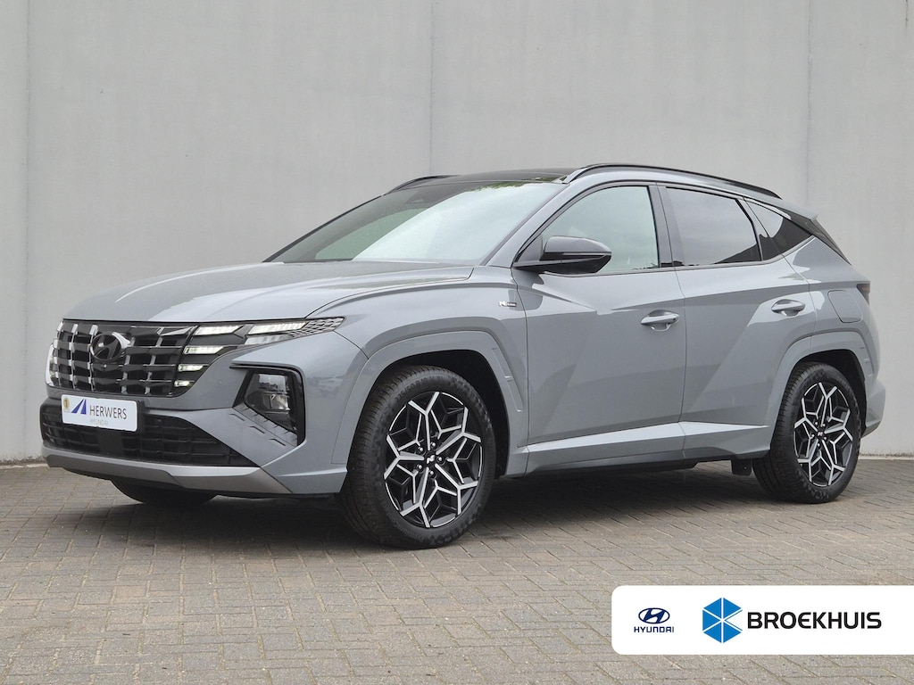 Hyundai Tucson 1.6 T-GDI HEV N Line Sky / Dealer onderhouden / Fabrieksgarantie tot 03-2027 / Trekhaak afneembaar / Panorama schuifdak / Trekgewicht 1650 kg / Navigatie / Apple Carplay Android / Elektrische achterklep / Stuur- Stoel & Achterbank verwarming / Rondomzicht camera /