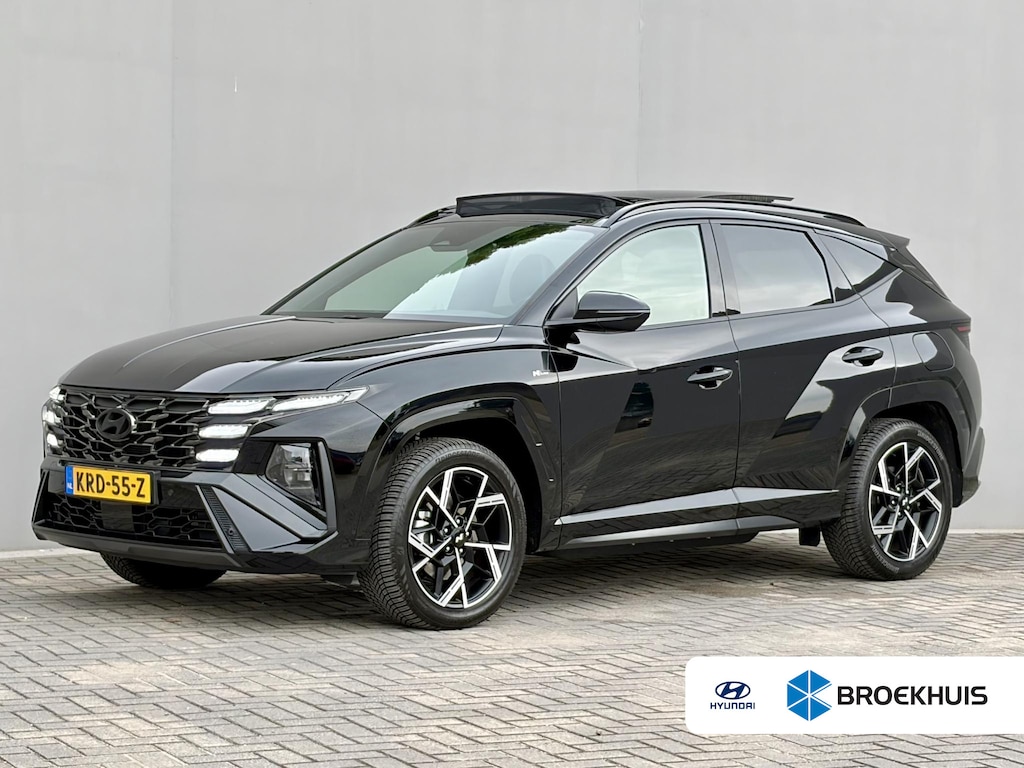 Hyundai Tucson 1.6 T-GDI PHEV N Line Sky 4WD / Facelift / Fabrieksgarantie tot 12-2029 / Dealer onderhouden / Panorama schuifdak / Navigatie / Camera / Elektrische Achterklep / Stuur & Stoelverwarming / Apple Carplay Android / 19" LM wielen /
