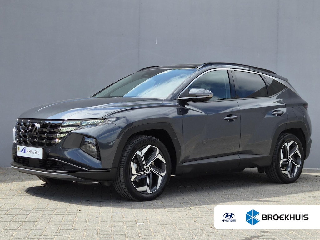 Hyundai Tucson 1.6 T-GDI PHEV Comfort Smart 4WD / Fabrieksgarantie tot 02-2029 / Dealer onderhouden / Glazen schuif- en kanteldak / Stuur- & Stoelverwarming / Trekgewicht 1350 kg / Achteruitrijcamera / Apple Carplay Android Auto / Adaptief cruise control /
