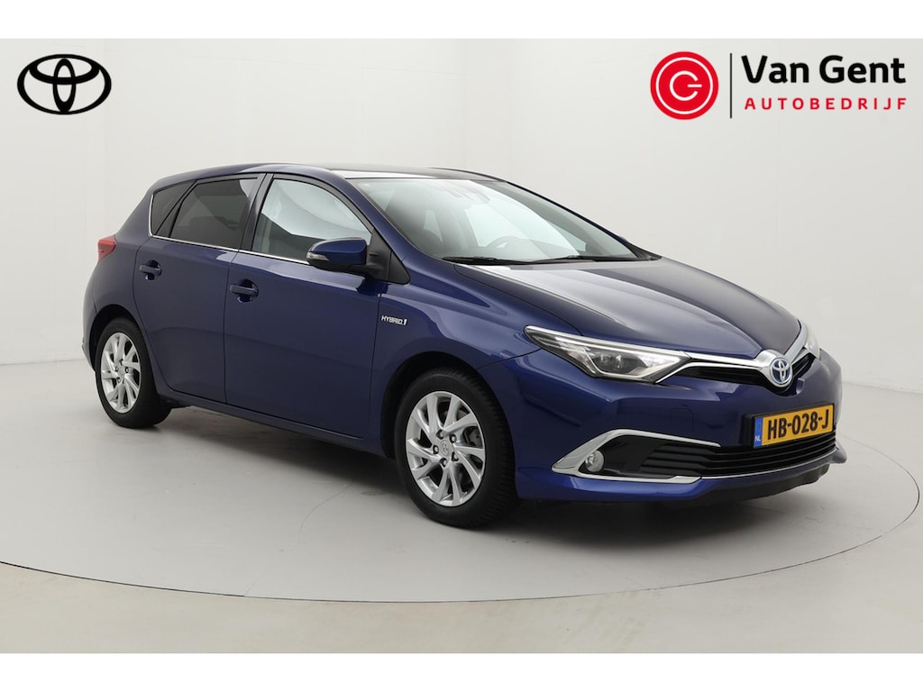Toyota Auris 1.8 Hybrid Lease Pro | Panoramadak | Trekhaak | Navigatie | Stoelverwarming | Keyless | Parkeersensoren voor/achter | LED | Cruise Control | Clima | Camera | 16 inch | Rijstrooksensor | Bluetooth