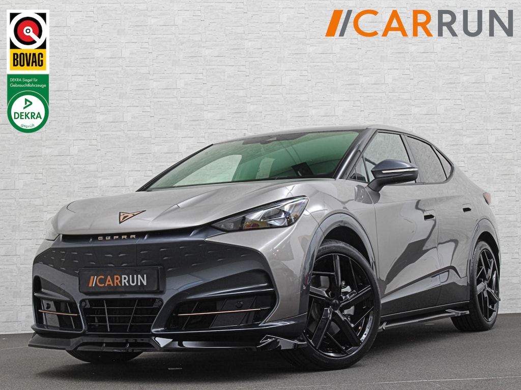 CUPRA Tavascan 286pk 77 kWh Aero-pack | Nieuw! | Winter-Pack | Warmtepomp | Verlengde Fabrieksgarantie | 7x Op Voorraad | Adaptive Cruise Control | 3-Zone Clima | Verwarmde Voorruit | Keyless-Entry | Sfeerverlichting | Stoelverwarming | Carplay | Stuurverwarming | Getint Glas | 19 inch | Lane-Assist | Camera | Draadloos Laden |
