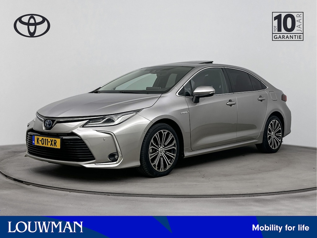 Toyota Corolla 1.8 Hybrid Executive | Navigatie | Glazen Schuifdak | Half Leder | Stoel & Stuur Verwarming |