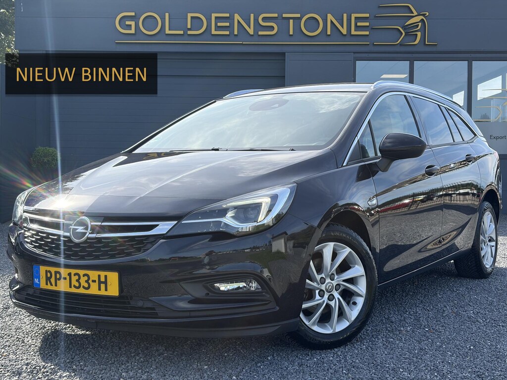 Opel Astra Sports Tourer 1.4 Business Executive ✓2 Eigenaar✓Camera✓Navi✓Trekhaakt✓Carplay✓Stoelverw✓Stuurverw✓Automaat✓Dealer Onderhouden✓Keyless✓Clima✓Cruise✓Pdc V+A✓Halfleder✓Comfortstoelen✓150pk✓Rijstrooksensor✓Dodehoeksensor✓Elekt Stoelen✓Lm velgen✓N.A.P✓Apk tot 03-2027