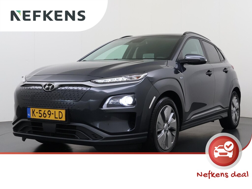 Hyundai Kona Limited 64kWh | 1ste eigenaar | ACCU 98% | LEER | Electrische stoelen | Dodehoekdetectie | AUTOMAAT