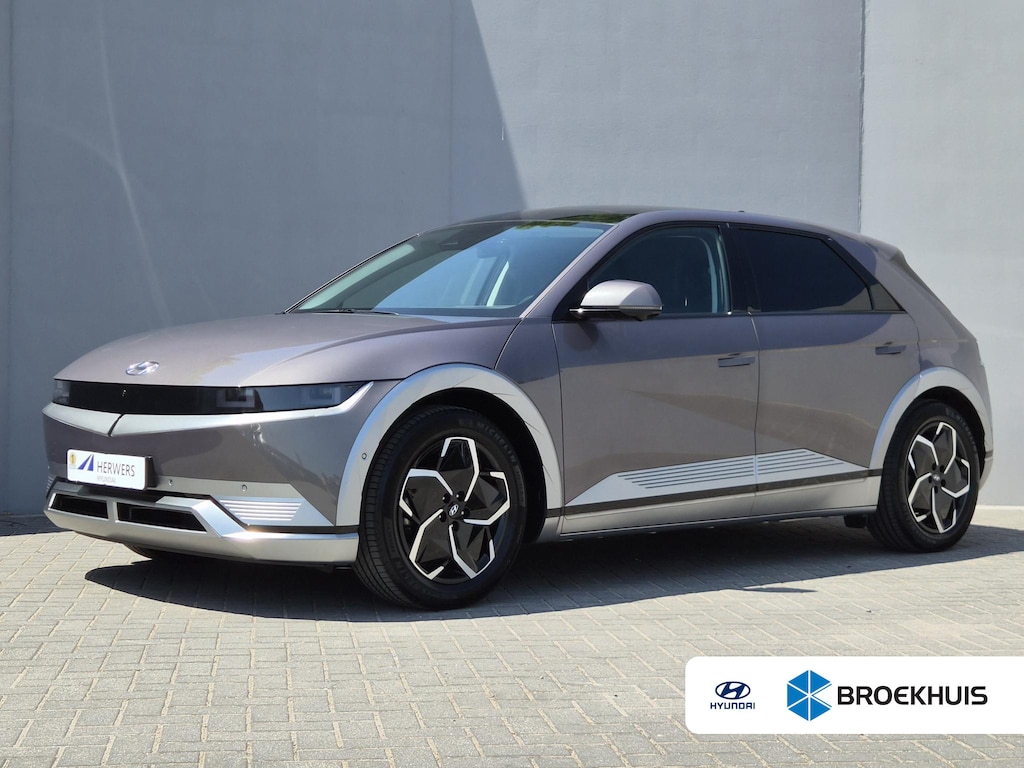 Hyundai Ioniq 5 Lounge 73kWh / SOH 100% / SOLAR dak / Fabrieksgarantie tot 05-2027 / Dealer onderhouden / Head Up Display / CCS snelladen / Warmtepomp / Trekgewicht 1600 kg / Stuur- Stoel & Achterbank verwarming / Rondomzicht camera / Bose Audio Systeem /