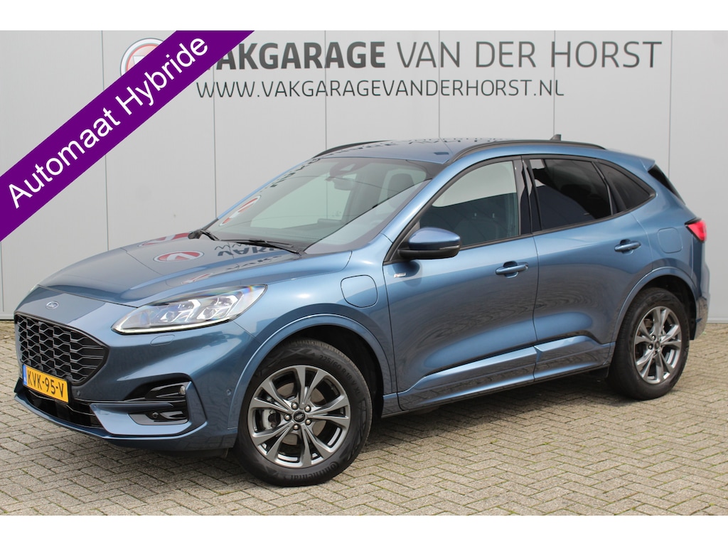 Ford Kuga 2.5-225pk PHEV ST-Line X. Hybride rijden voor een reëel bedrag ! Autm. airco dual, navigatie, telefoonvoorb., camera v+a, adaptieve cruise control, lane- en side assist, stoel-, stuur- en voorraamverw., Apple carplay/Android auto etc.