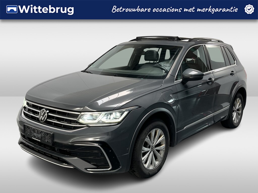 Volkswagen Tiguan 1.4 TSI eHybrid R-Line / AUTOMAAT/ PANO/ ACC/ PARK.SENSOR.V+A/ CAMERA/ APP-CONNECT/ STUUR+STOELVERWARM./ ELEK.ACHTERKLEP/ DIGITAL DASH/ NAVI/ DAB/ CLIMA/ IQ.LIGHT/ 19'' LMV
