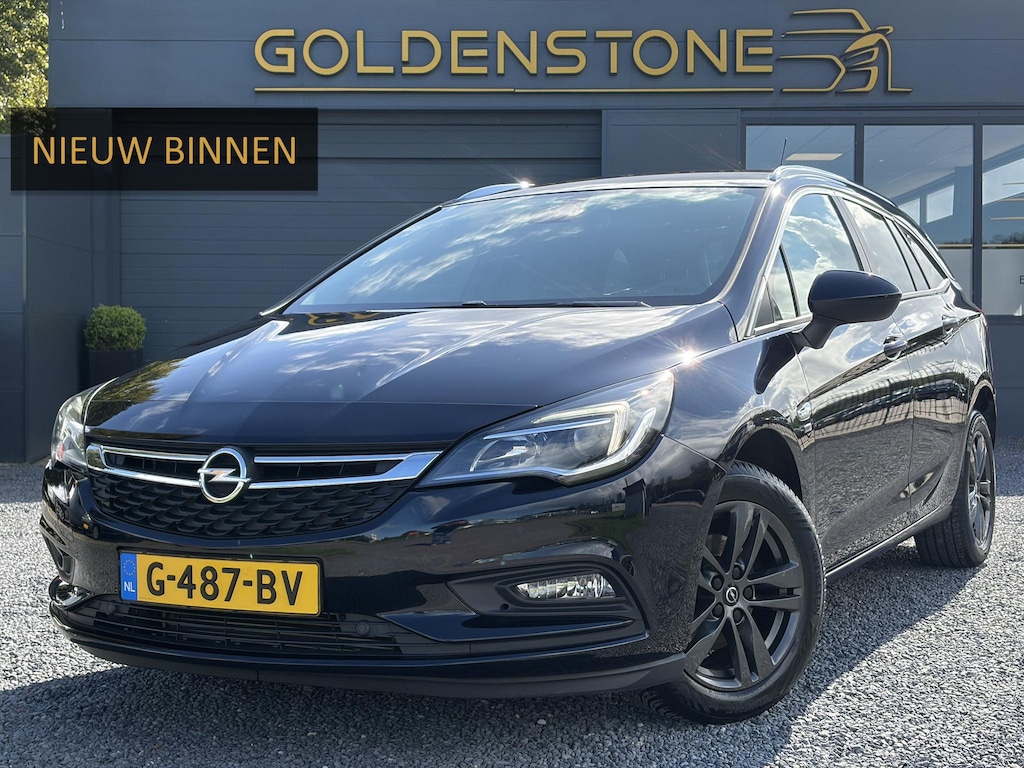 Opel Astra Sports Tourer 1.4 Turbo 120 Jaar Edition ✓150pk✓Carplay✓Navi✓Trekhaak✓Pdc V+A✓Clima✓Cruise✓6 Bak✓Lm velgen✓N.A.P✓Apk tot 02-2028