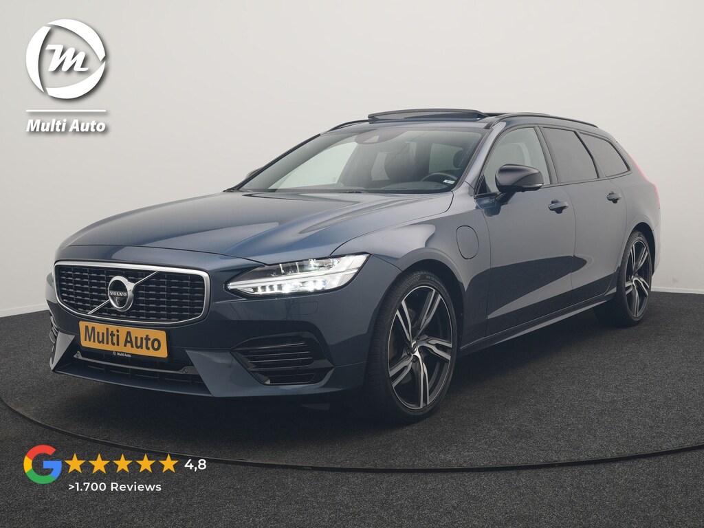 Volvo V90 T8 AWD R-Design PHEV 394pk Dealer O.H. | Trekhaak Af Fabriek | Four C Luchtvering | Panodak | Adaptive Cruise | Head Up | 360 Camera | Bowers & Wilkins | Lederen Sportstoelen Massage & Ventilatie & Memory | Stoelen & Stuur Verwarm Apple Carplay | Navigatie | DAB | 20"L.M | Plug In Hybrid |