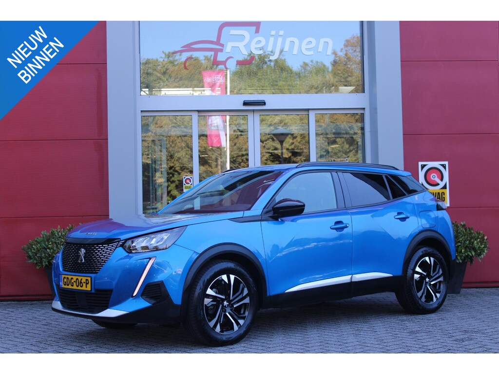 Peugeot 2008 1.2 130PK ALLURE PACK | TREKHAAK AFNEEMBAAR | NAVIGATIE 10" TOUCHSCREEN | APPLE CARPLAY/ANDROID AUTO | ACHTERUITRIJ CAMERA | 3-D INSTRUMENTENPANEEL | CLIMATE CONTROL | CRUISE CONTROL | KEYLESS ENTRY / START | 17" LICHTMETALEN VELGEN |