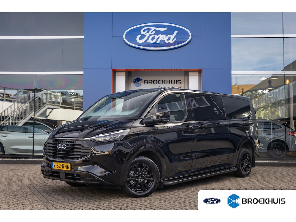 Ford Transit Custom 320 2.5 PHEV L2H1 Limited Black Platinum Dubbel Cabine | DEMO-DEAL | 360 camera | Leder | Cruise adaptief | Dubbele zijschuifdeur | Stoel/stuur/voorruit verwarming | Apple Carplay/Android Auto | 17 inch lichtmetalen velgen (Carbonised Grey) | 8-weg verstelbare bestuurdersstoel incl. lendensteun en verstelbare armsteunen | Achteruitrijcamera