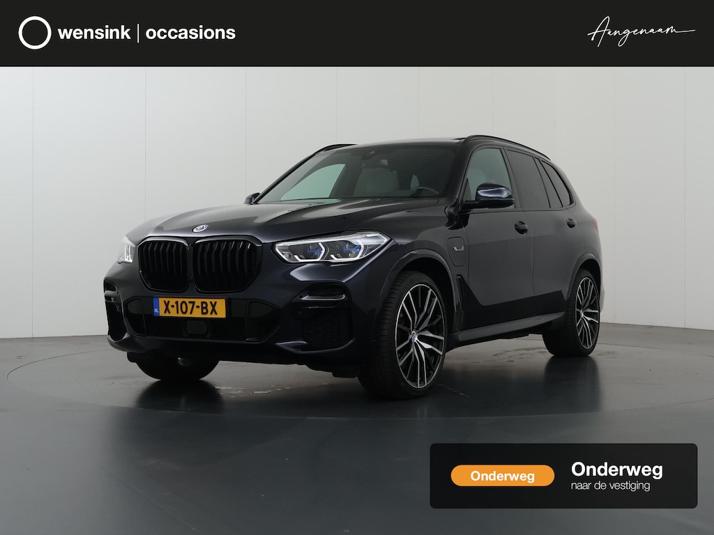 BMW X5 xDrive45e High Executive M Sport | SOH 91,3% | Elek. Trekhaak | Luchtvering | Panoramadak | Harman/Kardon | Cruise Control Adaptief | Lederen bekleding | Elek. Stoelen met Geheugen | Elek. Achterklep | Apple Carplay/Android Auto | Keyless Entry/Go |