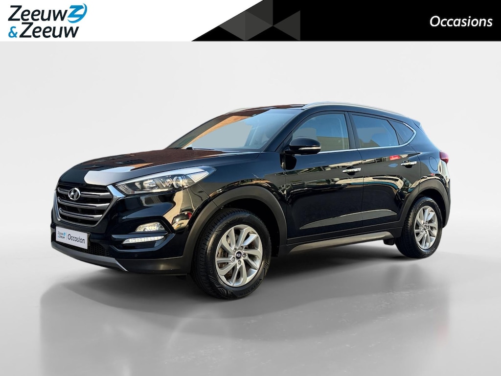 Hyundai Tucson 1.6 GDi Comfort | Elektrisch Verstelbare Stoelen | Navigatie | Bluetooth | Camera | Stoelverwarming | Cruise & Climate Control | Onderhoudshistorie | All Season Banden | 12 Maanden BOVAG Garantie