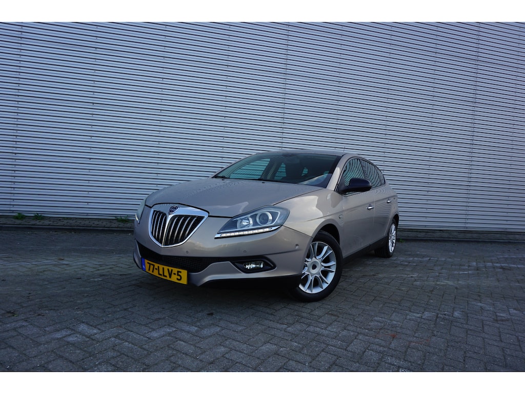 Lancia Delta 1.4-16V Oro Climate / Navi / Cruise / Parkeers. / Elektr. ramen / Trekhaak / Lm velgen / NAP