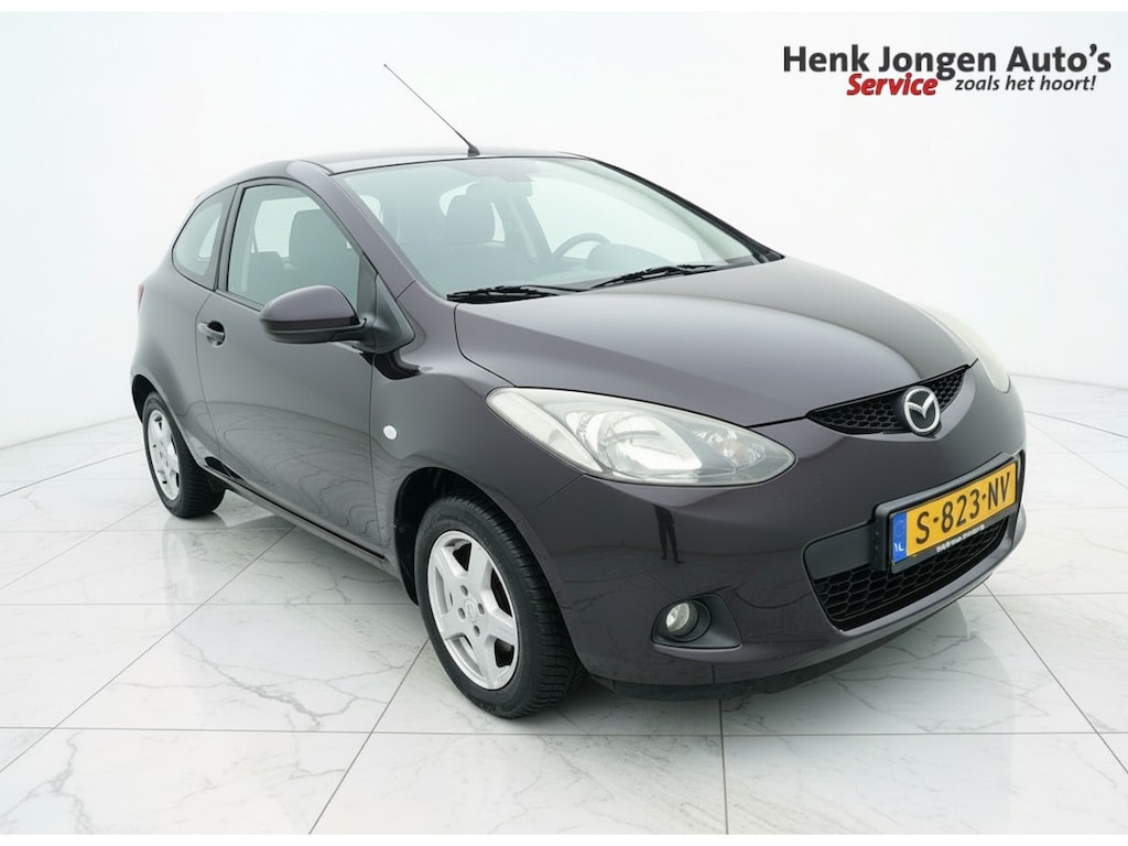 Mazda 2 1.3 TS Plus  “Sinds 1970 | 5.000+ reviews | Score 9,5 | Service zoals ’t hoort” Henk Jongen Auto's in Helmond,  al 50 jaar service zoals 't hoort!