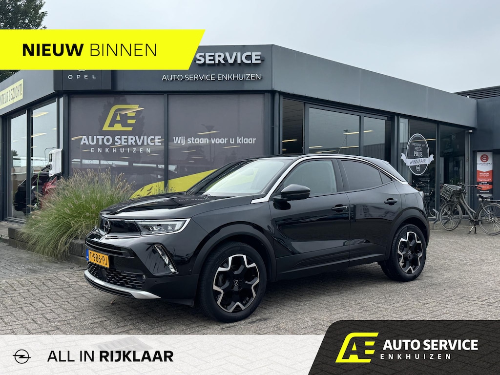 Opel Mokka 1.2 Turbo Ultimate AUT Rijklaar incl. grote beurt en 100% dealer onderhouden bij ons! | Keyless | Camera | Alcantara lederen stoelen met verwarming | Stuurverwarming | Carplay | Distr. v.v. | All season banden | Full LED